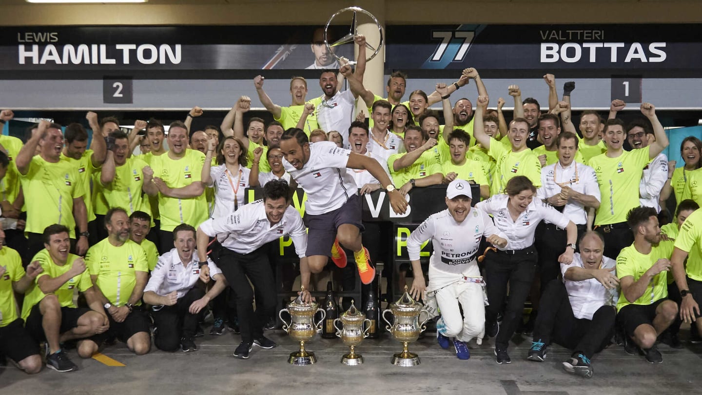 BAHRAIN INTERNATIONAL CIRCUIT, BAHRAIN - MARCH 31: Winner Lewis Hamilton, Mercedes AMG F1 and Valtteri Bottas, Mercedes AMG F1 celebrate with colleagues, including Toto Wolff, Executive Director (Business), Mercedes AMG during the Bahrain GP at Bahrain International Circuit on March 31, 2019 in Bahrain International Circuit, Bahrain. (Photo by Steve Etherington / LAT Images)