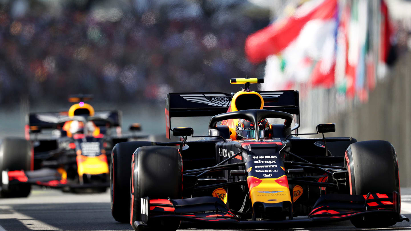 SAO PAULO, BRAZIL - NOVEMBER 16: Alexander Albon of Thailand driving the (23) Aston Martin Red Bull Racing RB15 leads Max Verstappen of the Netherlands driving the (33) Aston Martin Red Bull Racing RB15 on track during qualifying for the F1 Grand Prix of Brazil at Autodromo Jose Carlos Pace on November 16, 2019 in Sao Paulo, Brazil. (Photo by Mark Thompson/Getty Images)