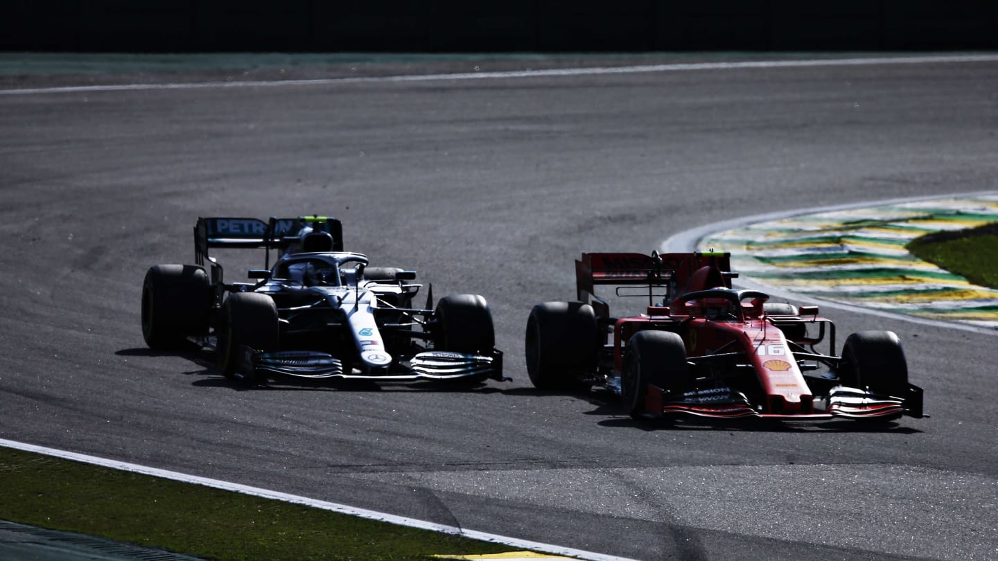 SAO PAULO, BRAZIL - NOVEMBER 17: Charles Leclerc of Monaco driving the (16) Scuderia Ferrari SF90 leads Valtteri Bottas driving the (77) Mercedes AMG Petronas F1 Team Mercedes W10 on track during the F1 Grand Prix of Brazil at Autodromo Jose Carlos Pace on November 17, 2019 in Sao Paulo, Brazil. (Photo by Charles Coates/Getty Images)