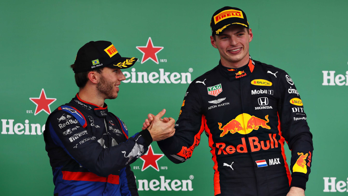 SAO PAULO, BRAZIL - NOVEMBER 17: Race winner Max Verstappen of Netherlands and Red Bull Racing and second placed Pierre Gasly of France and Scuderia Toro Rosso celebrate on the podium during the F1 Grand Prix of Brazil at Autodromo Jose Carlos Pace on November 17, 2019 in Sao Paulo, Brazil. (Photo by Mark Thompson/Getty Images)