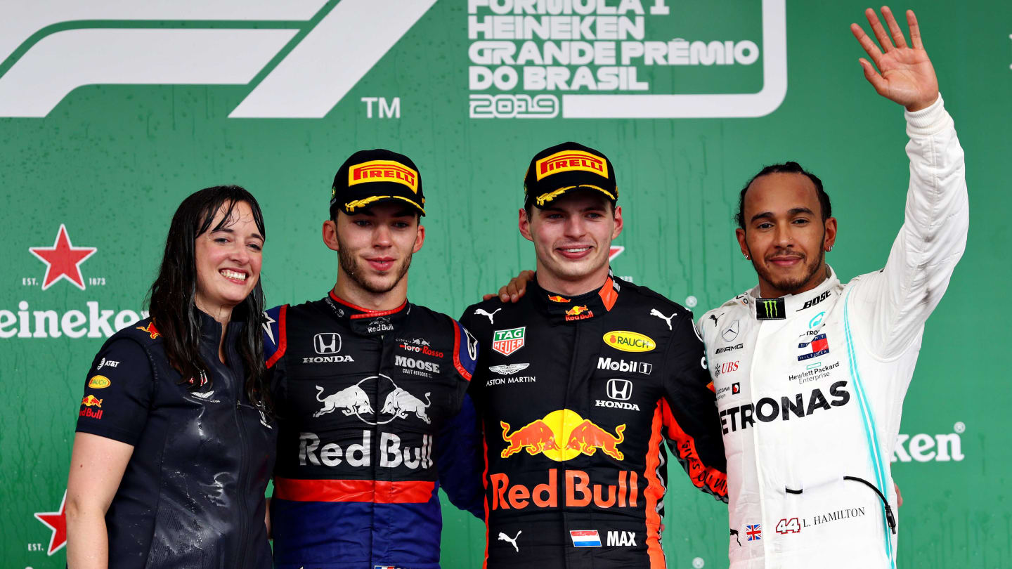 SAO PAULO, BRAZIL - NOVEMBER 17: Top three finishers Max Verstappen of Netherlands and Red Bull Racing, Pierre Gasly of France and Scuderia Toro Rosso and Lewis Hamilton of Great Britain and Mercedes GP celebrate on the podium during the F1 Grand Prix of Brazil at Autodromo Jose Carlos Pace on November 17, 2019 in Sao Paulo, Brazil. (Photo by Mark Thompson/Getty Images)