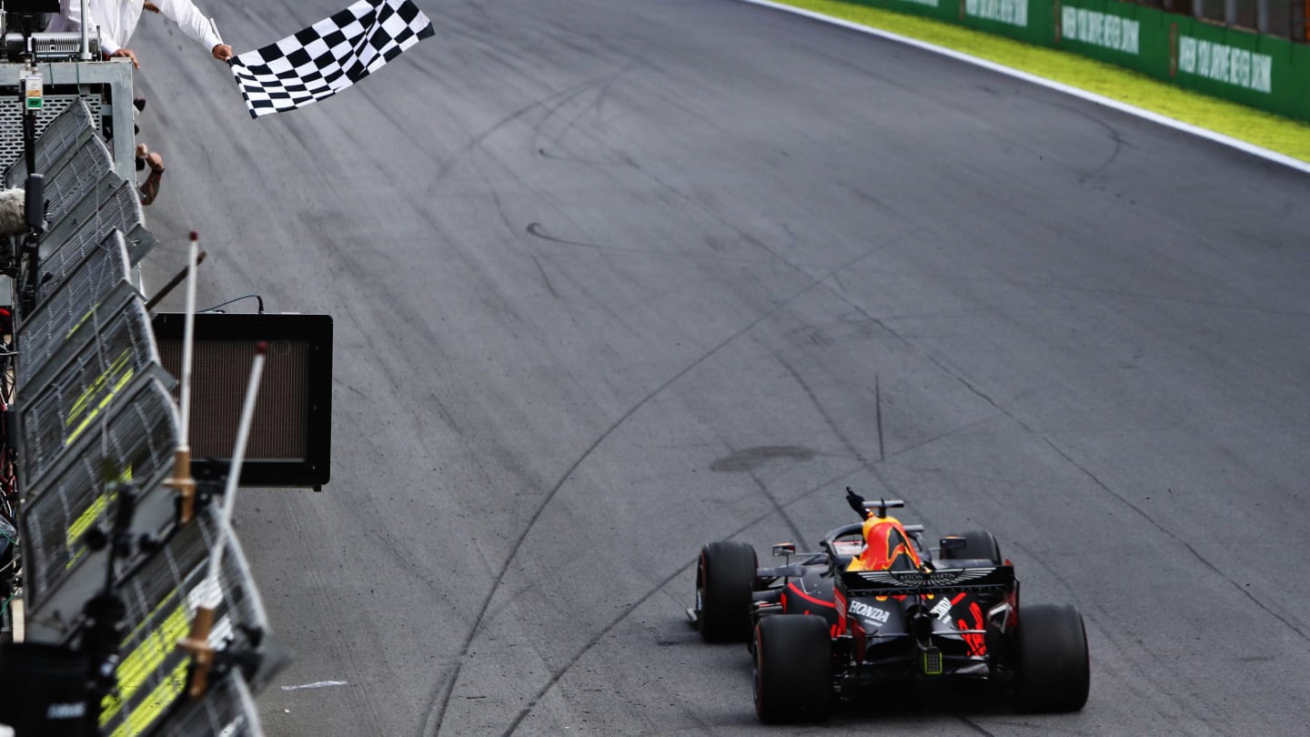 SAO PAULO, BRAZIL - NOVEMBER 17: Race winner Max Verstappen of the Netherlands driving the (33) Aston Martin Red Bull Racing RB15 takes the chequered flag during the F1 Grand Prix of Brazil at Autodromo Jose Carlos Pace on November 17, 2019 in Sao Paulo, Brazil. (Photo by Mark Thompson/Getty Images)