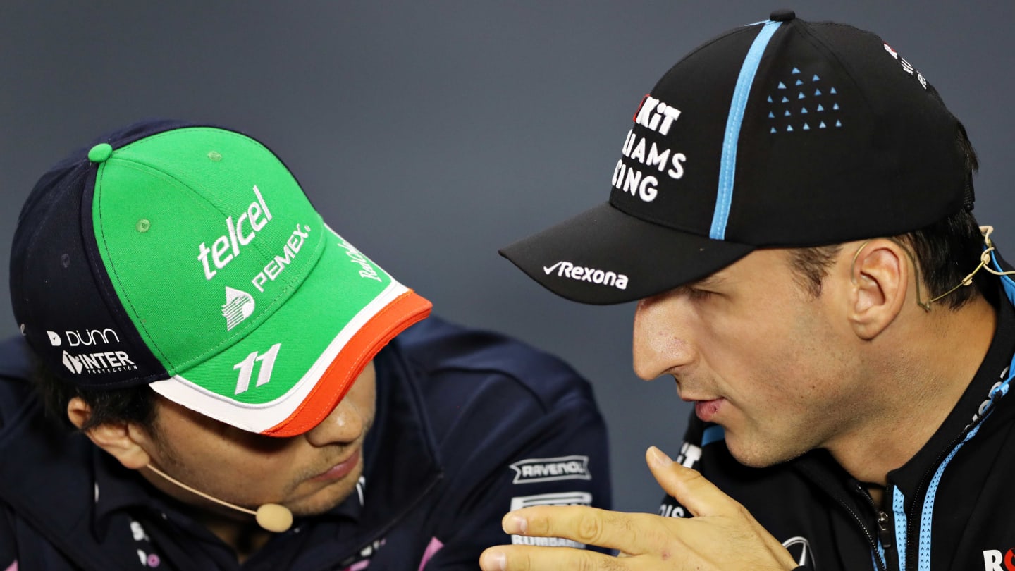 SAO PAULO, BRAZIL - NOVEMBER 14: Robert Kubica of Poland and Williams and Sergio Perez of Mexico and Racing Point talk in the Drivers Press Conference during previews ahead of the F1 Grand Prix of Brazil at Autodromo Jose Carlos Pace on November 14, 2019 in Sao Paulo, Brazil. (Photo by Robert Cianflone/Getty Images)