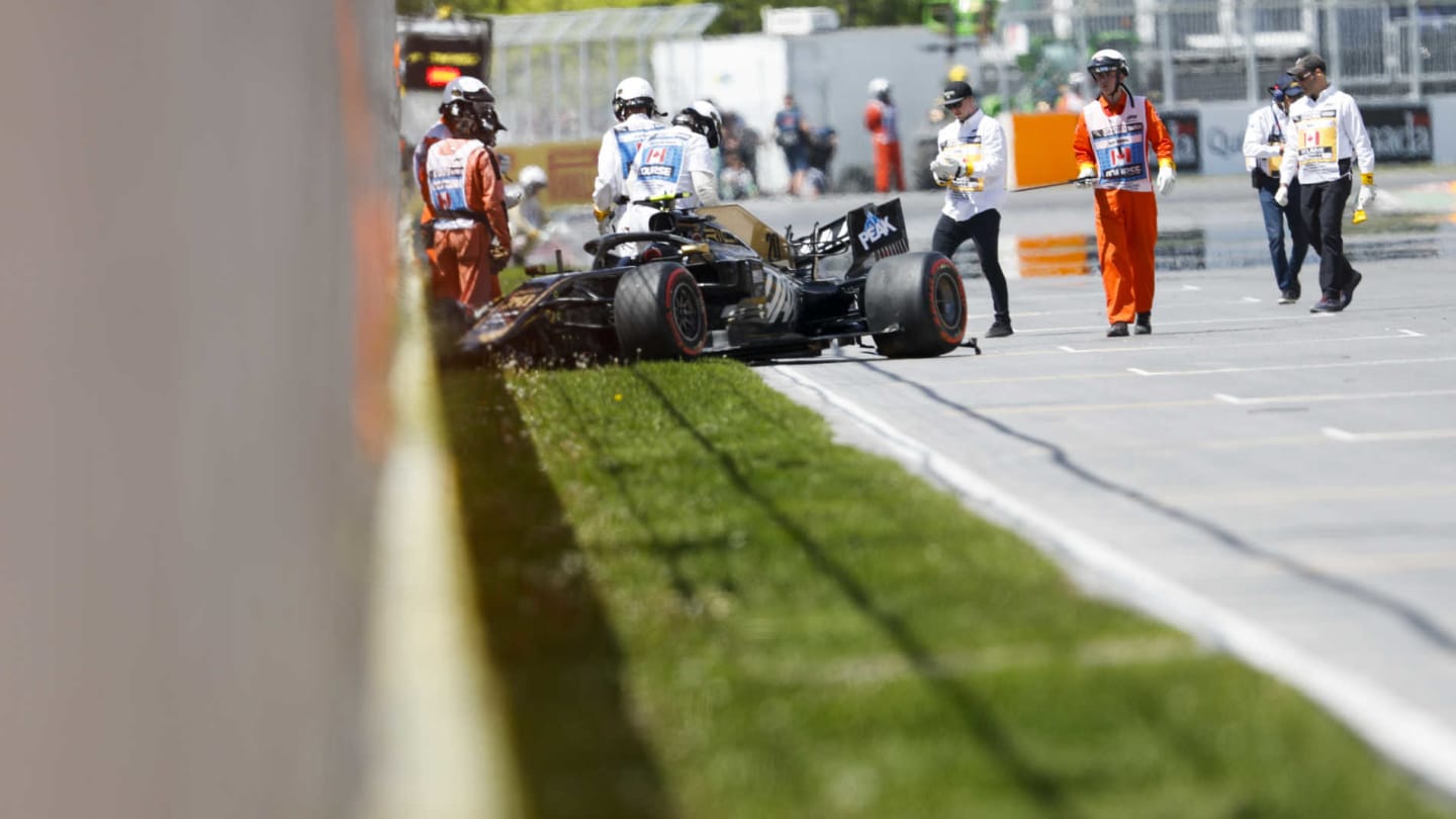 CIRCUIT GILLES-VILLENEUVE, CANADA - JUNE 08: Car of Kevin Magnussen, Haas VF-19 is recovered after