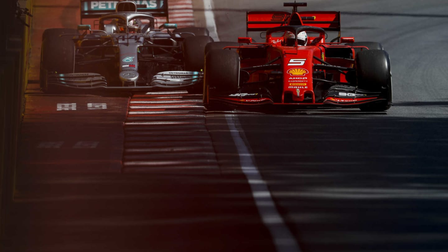 CIRCUIT GILLES-VILLENEUVE, CANADA - JUNE 09: Sebastian Vettel, Ferrari SF90, leads Lewis Hamilton,