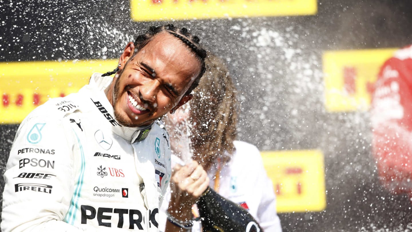 CIRCUIT GILLES-VILLENEUVE, CANADA - JUNE 09: Lewis Hamilton, Mercedes AMG F1, 1st position, sprays Champagne on the podium during the Canadian GP at Circuit Gilles-Villeneuve on June 09, 2019 in Circuit Gilles-Villeneuve, Canada. (Photo by Andy Hone / LAT Images)