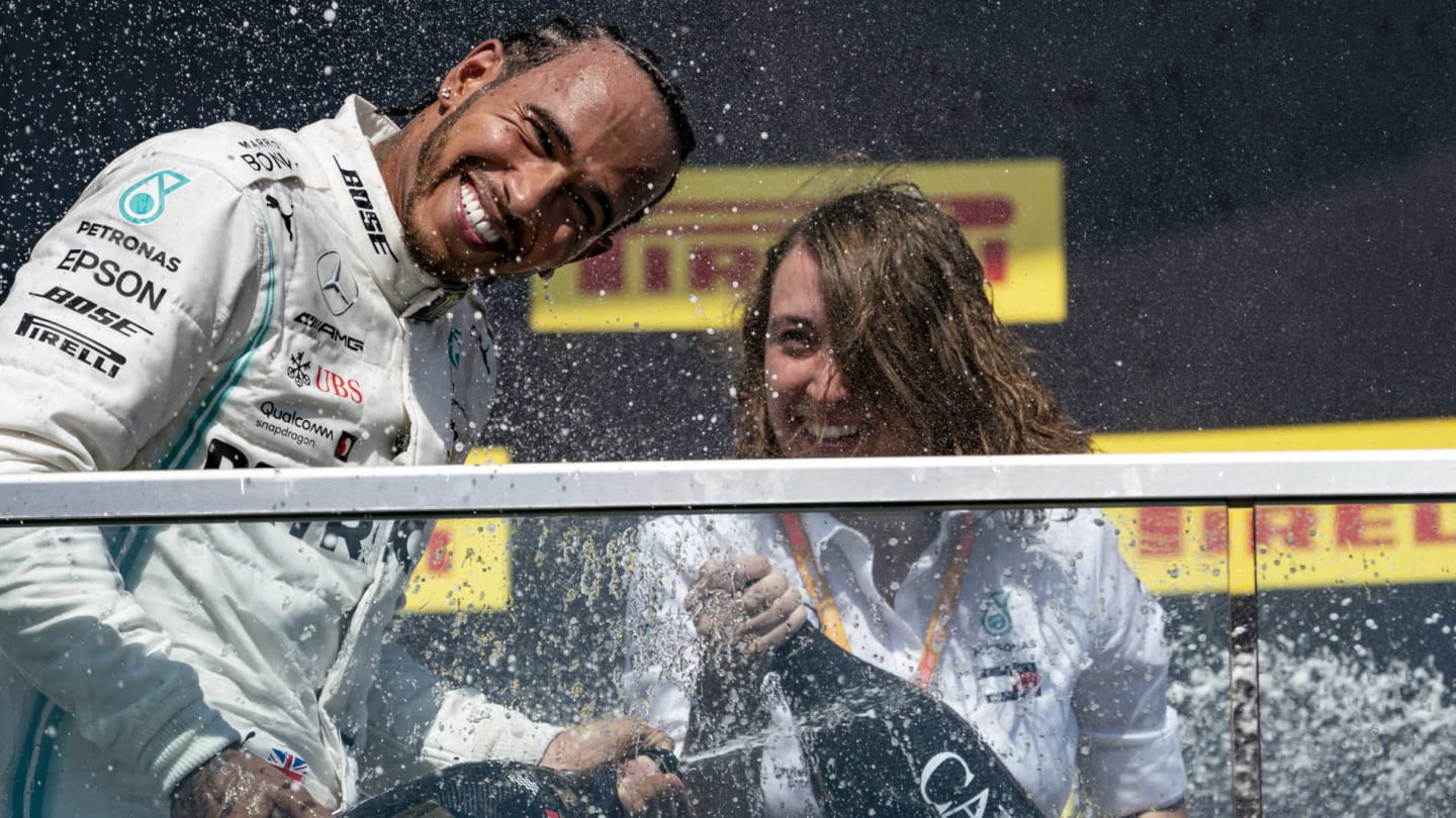 CIRCUIT GILLES-VILLENEUVE, CANADA - JUNE 09: Lewis Hamilton, Mercedes AMG F1, 1st position, sprays Champagne on the podium during the Canadian GP at Circuit Gilles-Villeneuve on June 09, 2019 in Circuit Gilles-Villeneuve, Canada. (Photo by Glenn Dunbar / LAT Images)