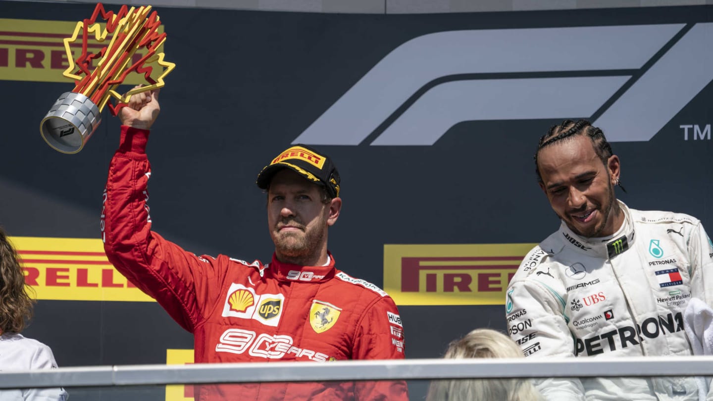 CIRCUIT GILLES-VILLENEUVE, CANADA - JUNE 09: Sebastian Vettel, Ferrari, 2nd position, lifts his trophy on the podium during the Canadian GP at Circuit Gilles-Villeneuve on June 09, 2019 in Circuit Gilles-Villeneuve, Canada. (Photo by Glenn Dunbar / LAT Images)
