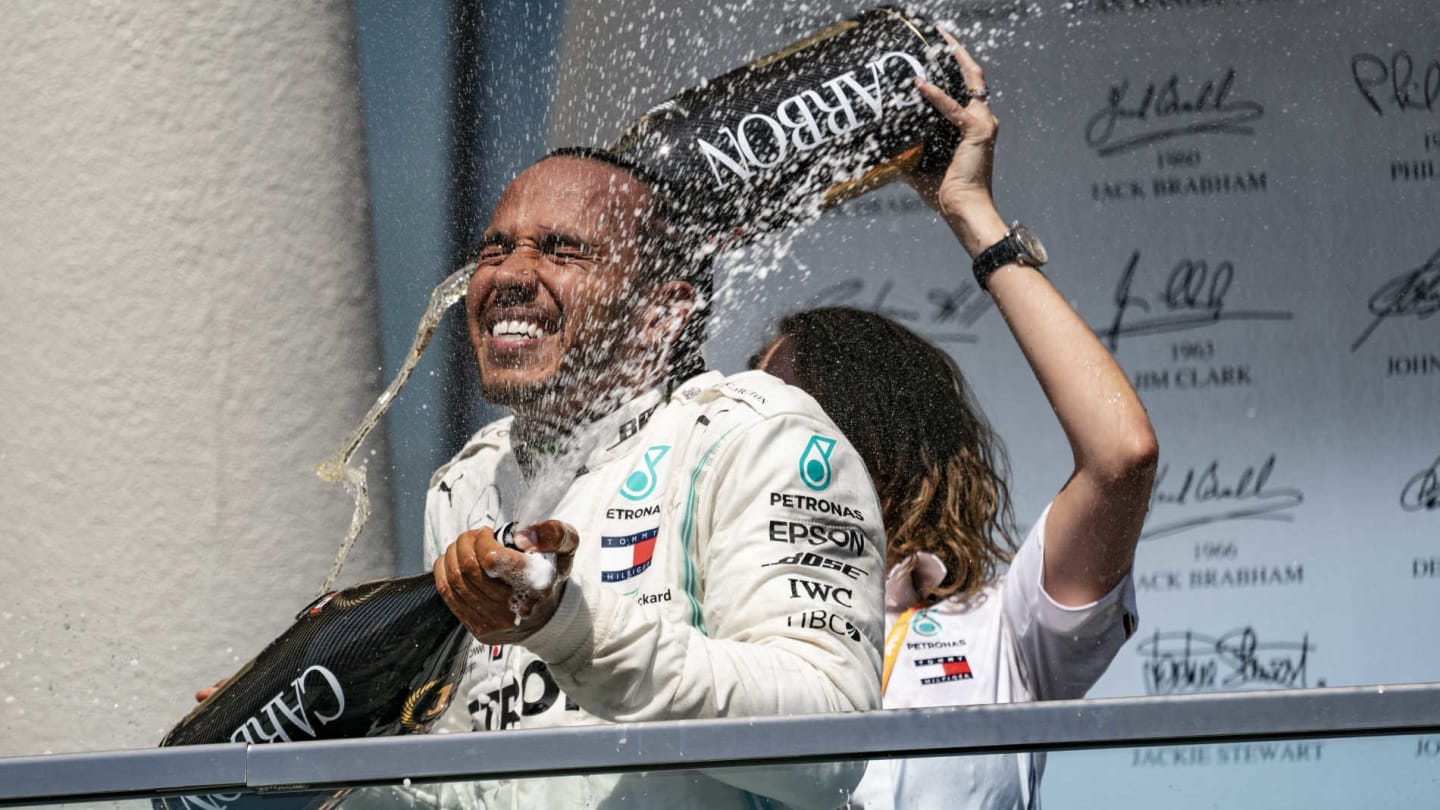 CIRCUIT GILLES-VILLENEUVE, CANADA - JUNE 09: Lewis Hamilton, Mercedes AMG F1, 1st position, celebrates on the podium with his team mate during the Canadian GP at Circuit Gilles-Villeneuve on June 09, 2019 in Circuit Gilles-Villeneuve, Canada. (Photo by Glenn Dunbar / LAT Images)