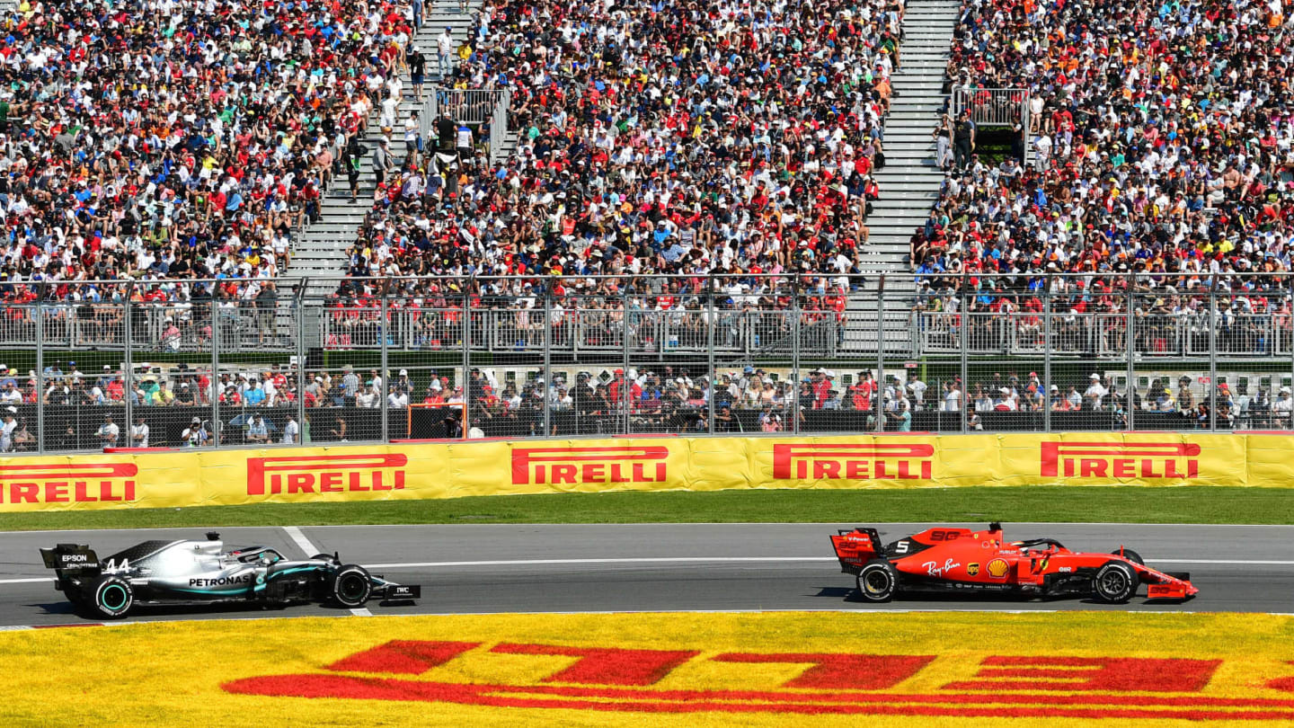 CIRCUIT GILLES-VILLENEUVE, CANADA - JUNE 09: Sebastian Vettel, Ferrari SF90, leads Lewis Hamilton,