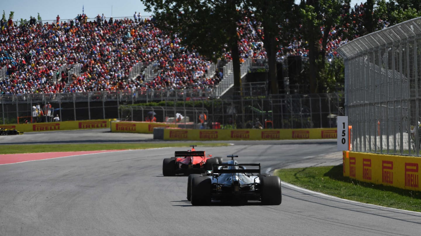 CIRCUIT GILLES-VILLENEUVE, CANADA - JUNE 09: Sebastian Vettel, Ferrari SF90, leads Lewis Hamilton,