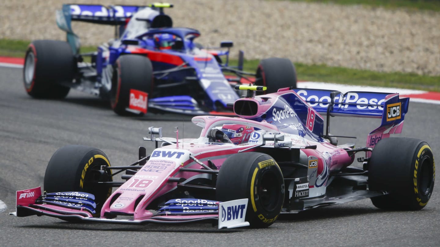 SHANGHAI INTERNATIONAL CIRCUIT, CHINA - APRIL 14: Lance Stroll, Racing Point RP19, leads Alexander Albon, Toro Rosso STR14 during the Chinese GP at Shanghai International Circuit on April 14, 2019 in Shanghai International Circuit, China. (Photo by Andy Hone / LAT Images)