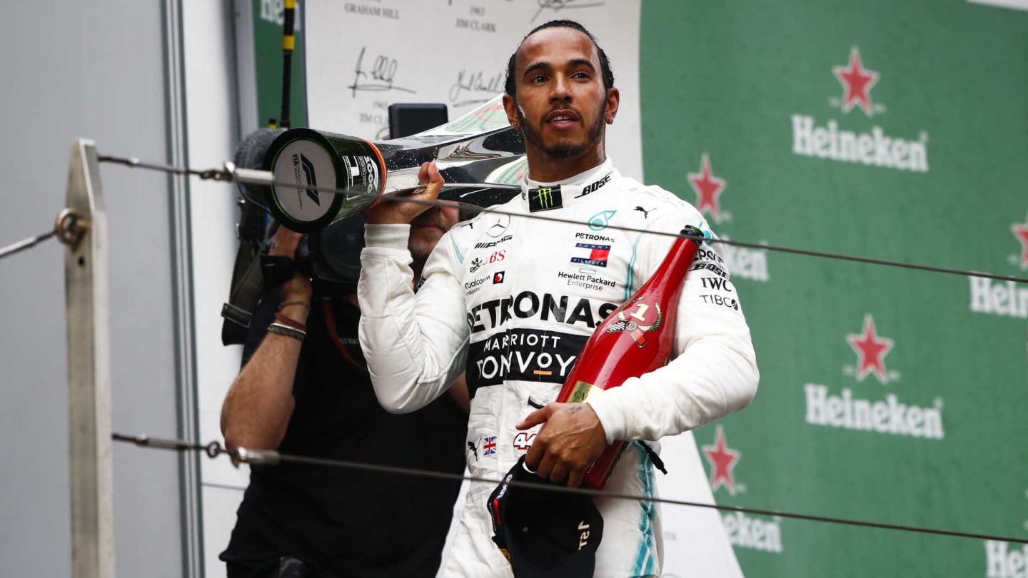 SHANGHAI INTERNATIONAL CIRCUIT, CHINA - APRIL 14: Lewis Hamilton, Mercedes AMG F1, 1st position, with his trophy and Champagne during the Chinese GP at Shanghai International Circuit on April 14, 2019 in Shanghai International Circuit, China. (Photo by Andy Hone / LAT Images)