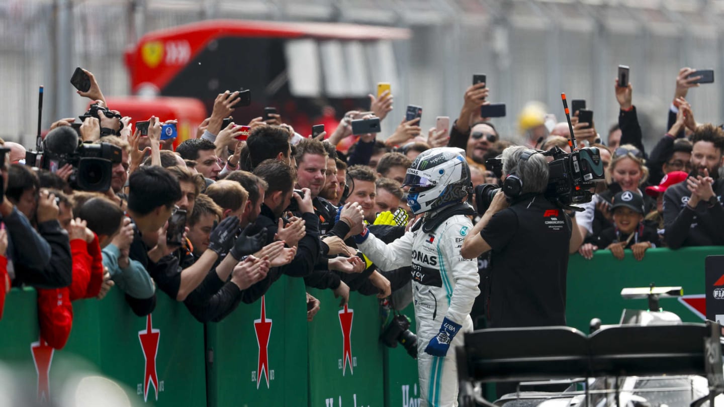 SHANGHAI INTERNATIONAL CIRCUIT, CHINA - APRIL 14: Valtteri Bottas, Mercedes AMG F1, 2nd position, celebrates with his team in Parc Ferme during the Chinese GP at Shanghai International Circuit on April 14, 2019 in Shanghai International Circuit, China. (Photo by Zak Mauger / LAT Images)