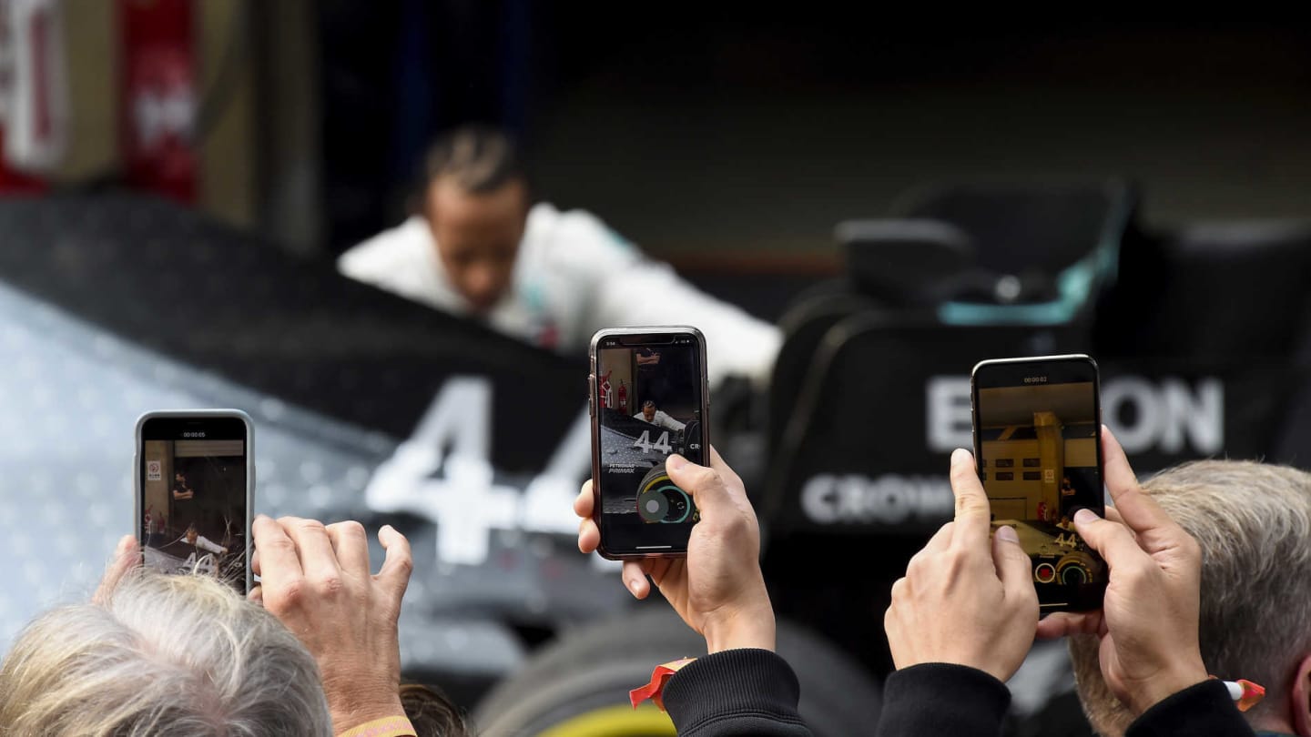 SHANGHAI INTERNATIONAL CIRCUIT, CHINA - APRIL 14: Photos are taken with phones as Lewis Hamilton,
