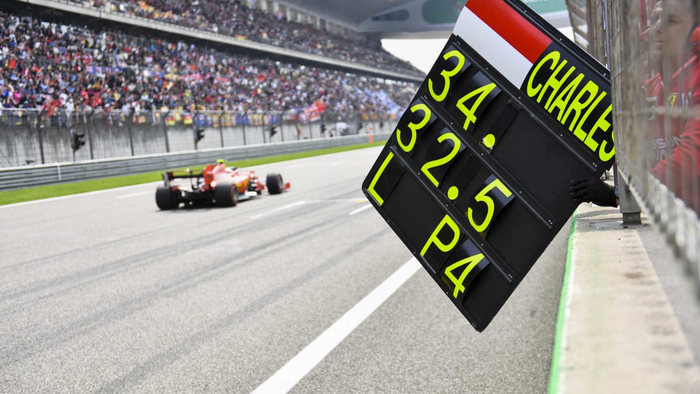 SHANGHAI INTERNATIONAL CIRCUIT, CHINA - APRIL 13: A team member pulls in the pit board after Charles Leclerc, Ferrari SF90, passes during the Chinese GP at Shanghai International Circuit on April 13, 2019 in Shanghai International Circuit, China. (Photo by Mark Sutton / Sutton Images)