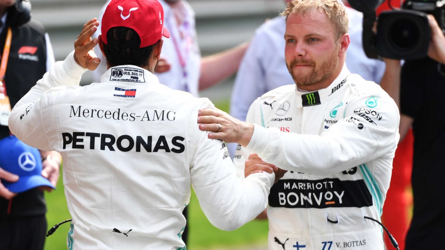 SHANGHAI INTERNATIONAL CIRCUIT, CHINA - APRIL 13: Lewis Hamilton, Mercedes AMG F1, and pole man Valtteri Bottas, Mercedes AMG F1, congratulate each other after Qualifying during the Chinese GP at Shanghai International Circuit on April 13, 2019 in Shanghai International Circuit, China. (Photo by Mark Sutton / Sutton Images)