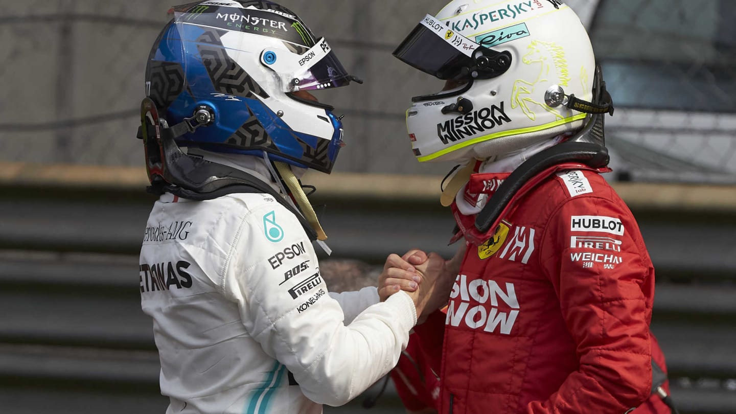 SHANGHAI INTERNATIONAL CIRCUIT, CHINA - APRIL 13: Sebastian Vettel, Ferrari, congratulates pole man