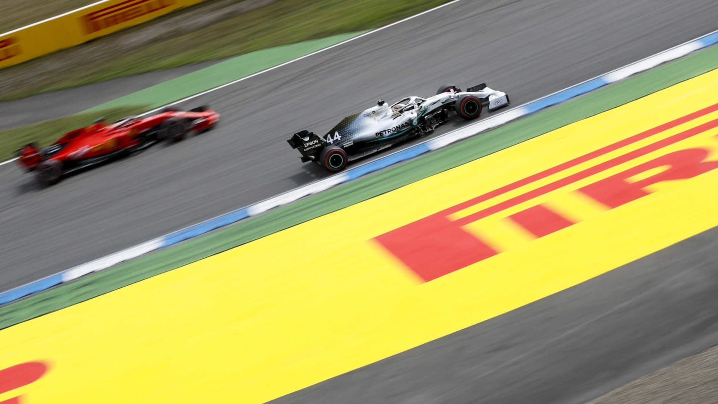 HOCKENHEIMRING, GERMANY - JULY 27: Lewis Hamilton, Mercedes AMG F1 W10, passes Sebastian Vettel,