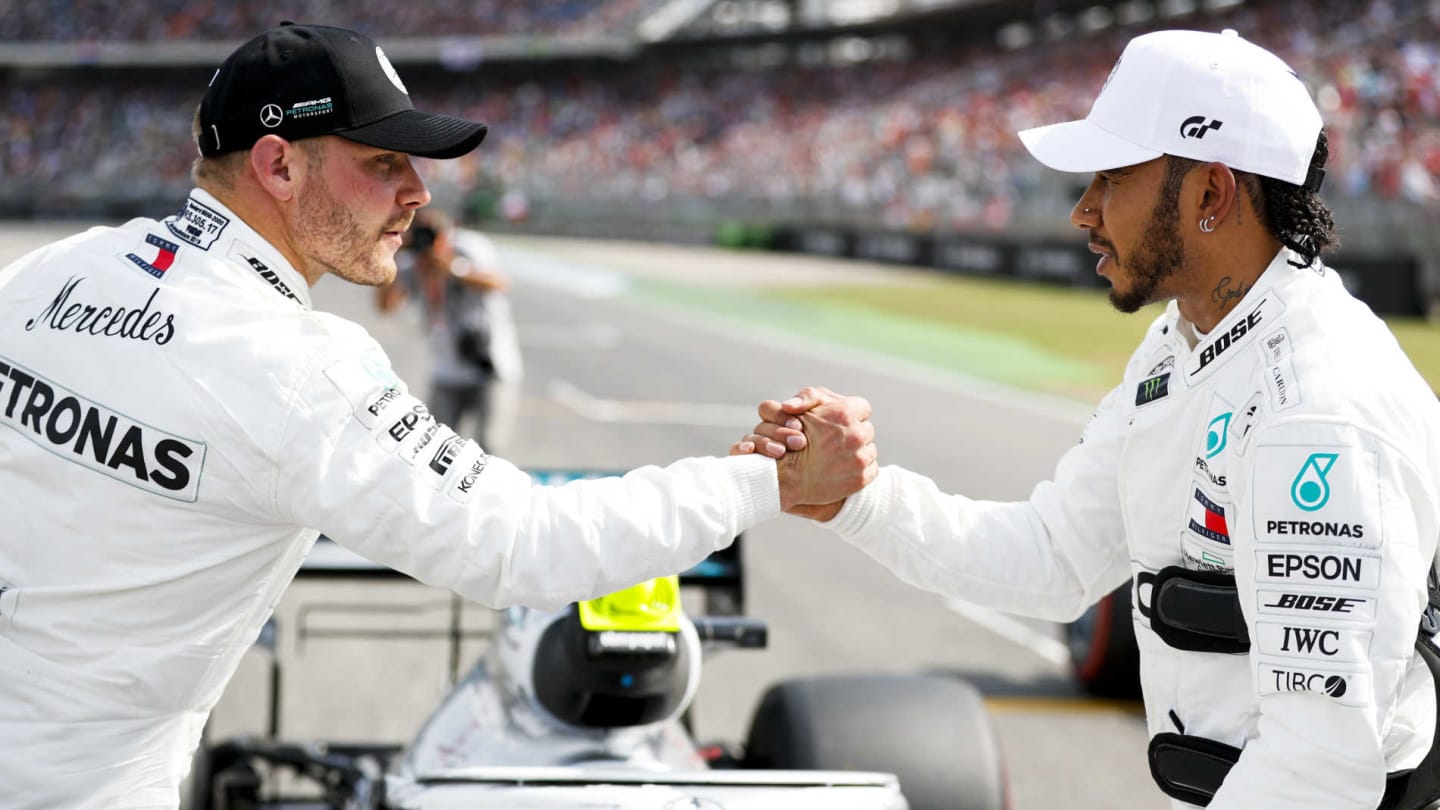 HOCKENHEIMRING, GERMANY - JULY 27: Valtteri Bottas, Mercedes AMG W10 and Pole Sitter Lewis Hamilton, Mercedes AMG F1 celebrate in Parc Ferme during the German GP at Hockenheimring on July 27, 2019 in Hockenheimring, Germany. (Photo by Steven Tee / LAT Images)