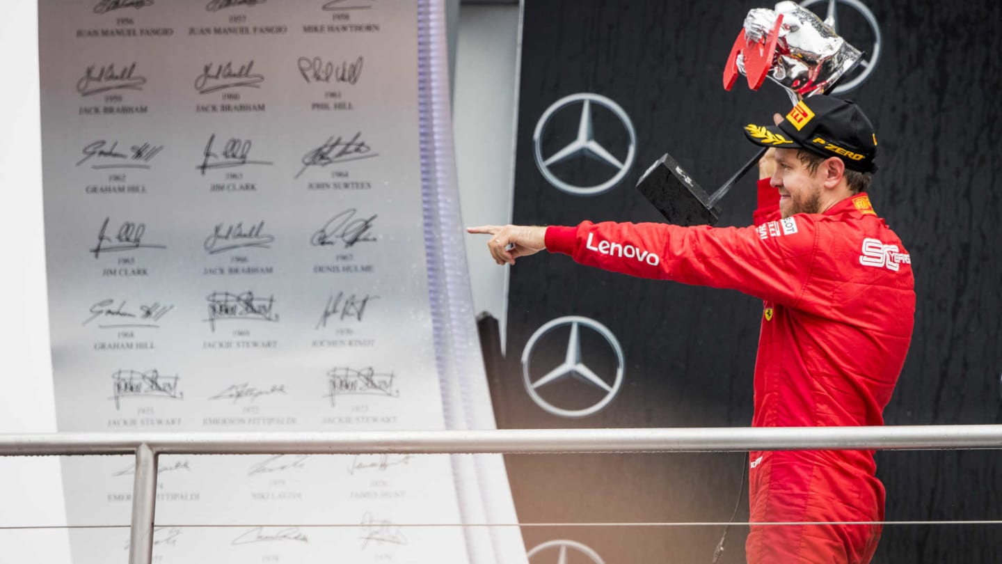 HOCKENHEIMRING, GERMANY - JULY 28: Sebastian Vettel, Ferrari celebrate on the podium with the trophy during the German GP at Hockenheimring on July 28, 2019 in Hockenheimring, Germany. (Photo by Sam Bloxham / LAT Images)