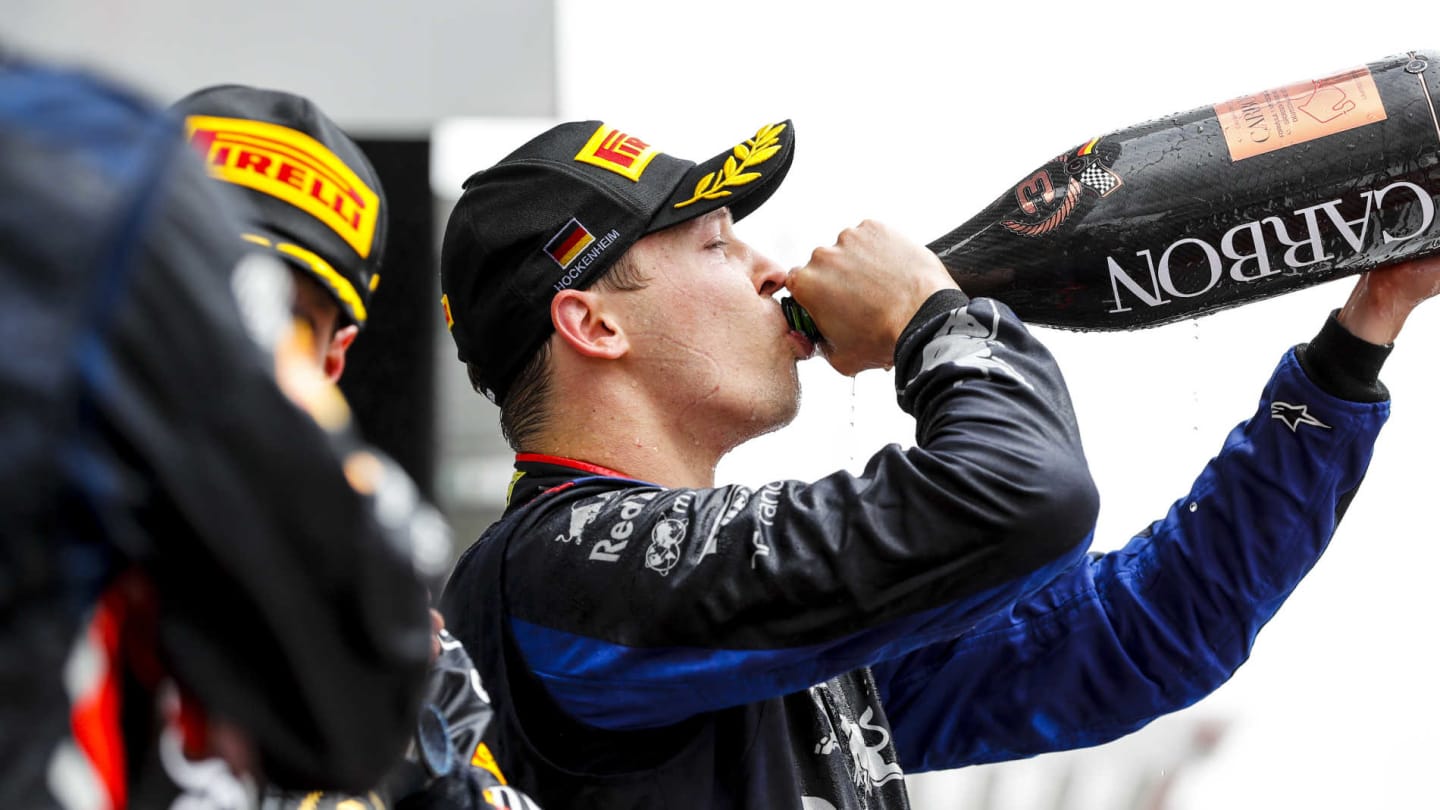 HOCKENHEIMRING, GERMANY - JULY 28: Daniil Kvyat, Toro Rosso, 3rd position, drinks Champagne on the