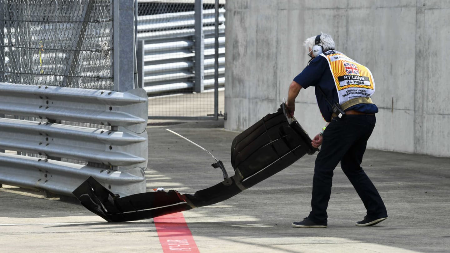 SILVERSTONE, UNITED KINGDOM - JULY 12: A Marshal removes the front wing of Romain Grosjean, Haas VF-19 during the British GP at Silverstone on July 12, 2019 in Silverstone, United Kingdom. (Photo by Mark Sutton / Sutton Images)