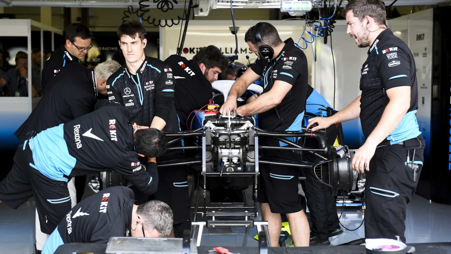 SILVERSTONE, UNITED KINGDOM - JULY 12: Williams mechanics assemble the car of George Russell,