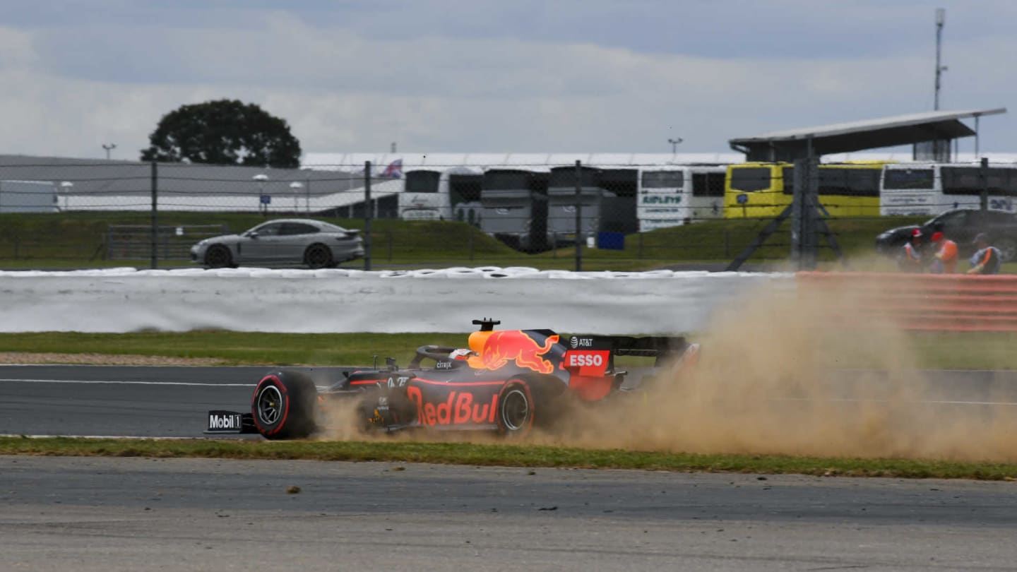 SILVERSTONE, UNITED KINGDOM - JULY 12: Max Verstappen, Red Bull Racing RB15, kicks up dust from the grass during the British GP at Silverstone on July 12, 2019 in Silverstone, United Kingdom. (Photo by Mark Sutton / Sutton Images)