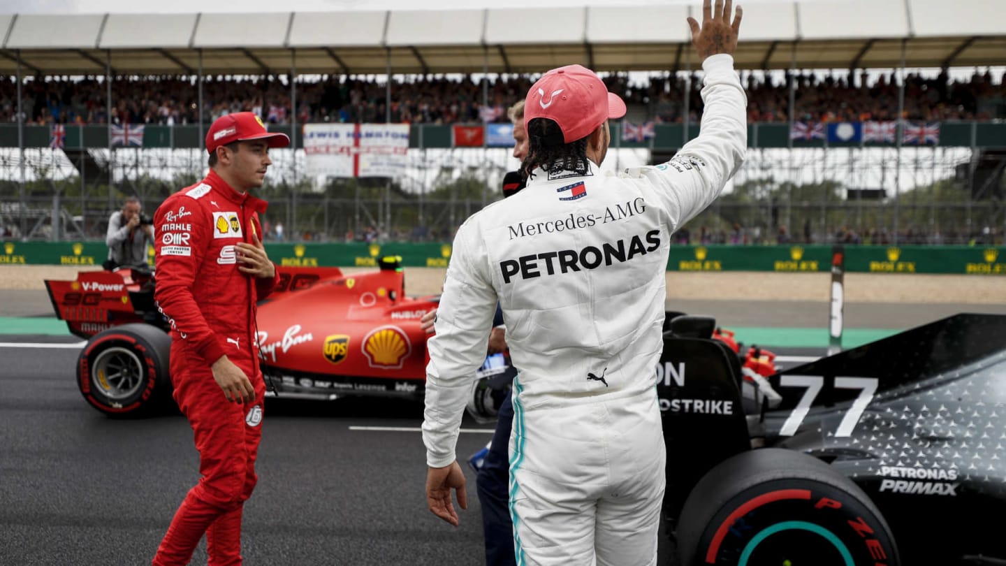 SILVERSTONE, UNITED KINGDOM - JULY 13: Charles Leclerc, Ferrari, and Lewis Hamilton, Mercedes AMG F1, on the grid after Qualifying during the British GP at Silverstone on July 13, 2019 in Silverstone, United Kingdom. (Photo by Glenn Dunbar / LAT Images)