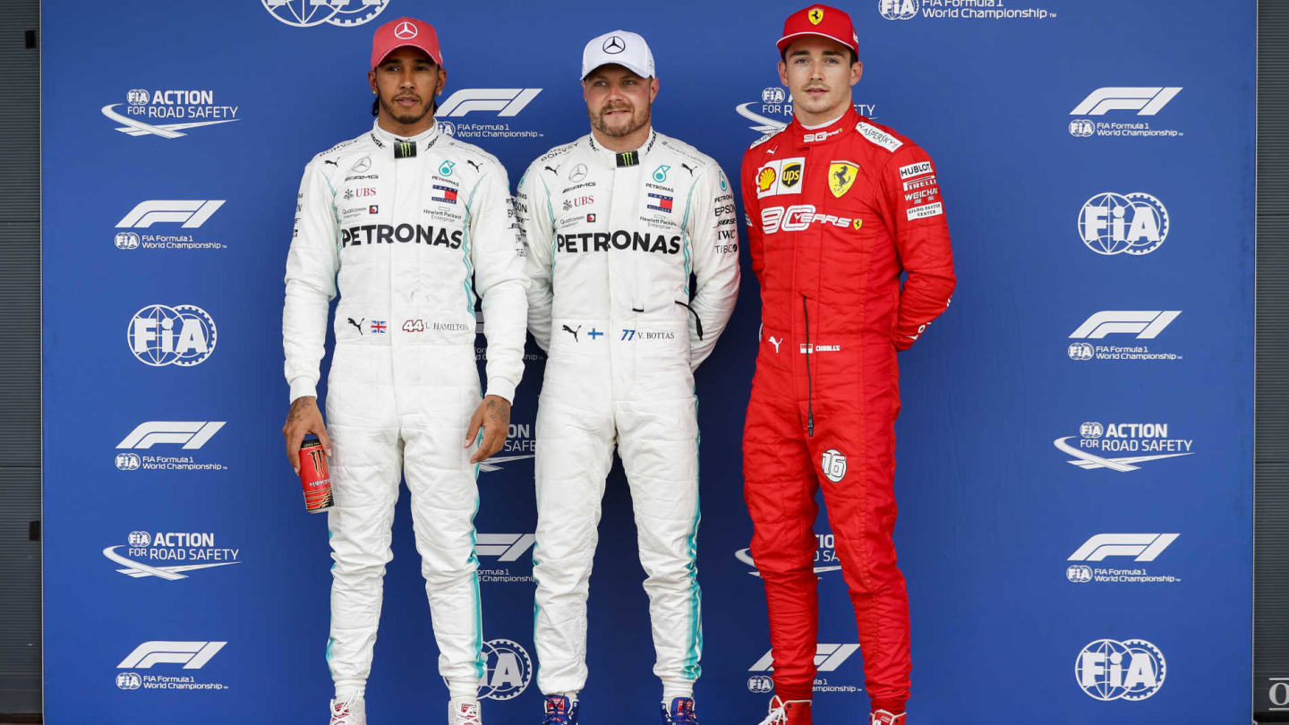 SILVERSTONE, UNITED KINGDOM - JULY 13: Top three Qualifiers Lewis Hamilton, Mercedes AMG F1, pole man Valtteri Bottas, Mercedes AMG F1, and Charles Leclerc, Ferrari during the British GP at Silverstone on July 13, 2019 in Silverstone, United Kingdom. (Photo by Zak Mauger / LAT Images)