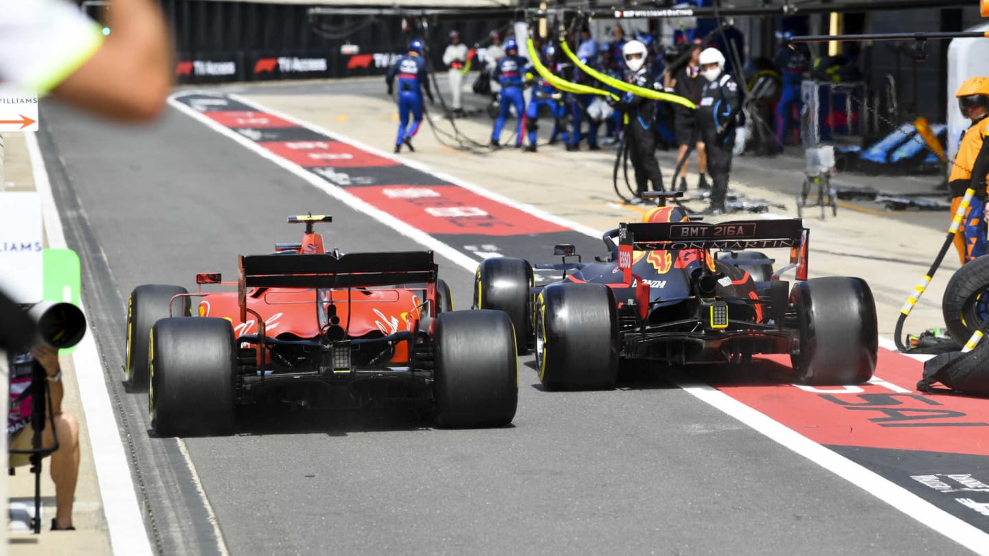 SILVERSTONE, UNITED KINGDOM - JULY 14: Charles Leclerc, Ferrari SF90 and Max Verstappen, Red Bull Racing RB15 wheel to wheel in the pit lane during the British GP at Silverstone on July 14, 2019 in Silverstone, United Kingdom. (Photo by Mark Sutton / Sutton Images)