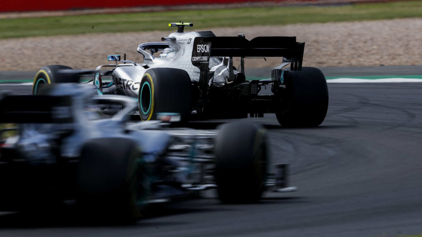SILVERSTONE, UNITED KINGDOM - JULY 14: Valtteri Bottas, Mercedes AMG W10, leads Lewis Hamilton, Mercedes AMG F1 W10 during the British GP at Silverstone on July 14, 2019 in Silverstone, United Kingdom. (Photo by Zak Mauger / LAT Images)