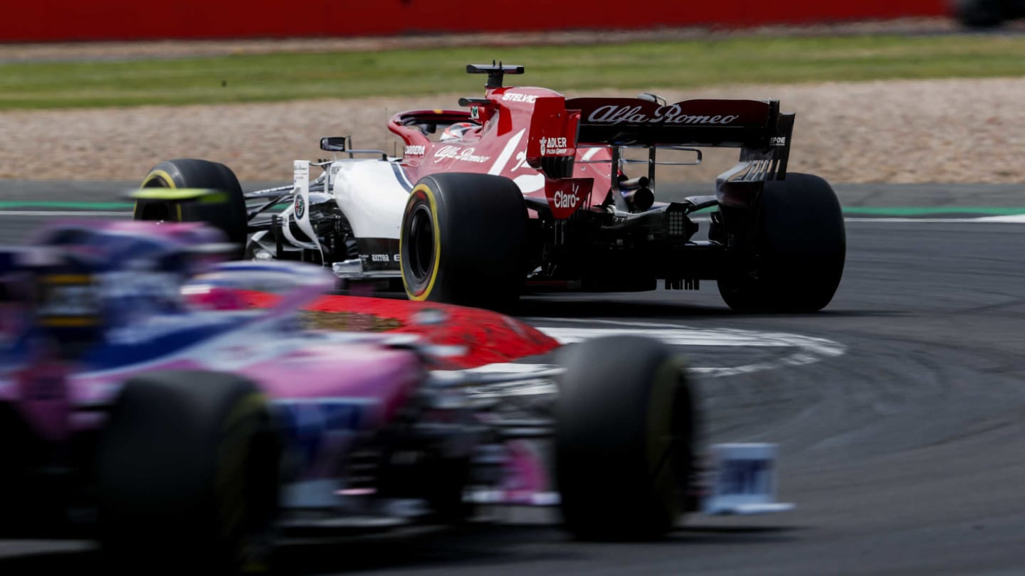 SILVERSTONE, UNITED KINGDOM - JULY 14: Kimi Raikkonen, Alfa Romeo Racing C38, leads Lance Stroll, Racing Point RP19 during the British GP at Silverstone on July 14, 2019 in Silverstone, United Kingdom. (Photo by Zak Mauger / LAT Images)