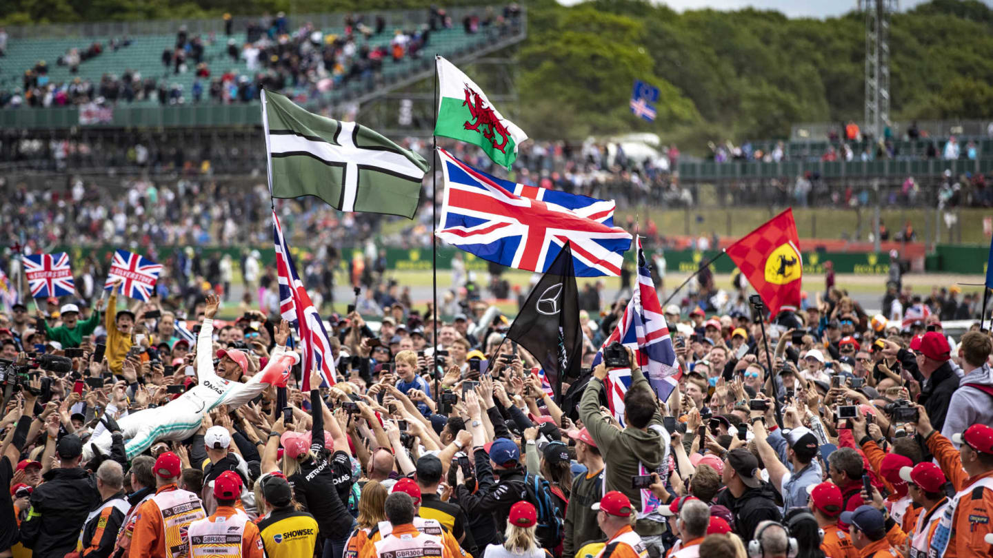 SILVERSTONE, UNITED KINGDOM - JULY 14: Lewis Hamilton, Mercedes AMG F1, 1st position, celebrates with his fans during the British GP at Silverstone on July 14, 2019 in Silverstone, United Kingdom. (Photo by Glenn Dunbar / LAT Images)