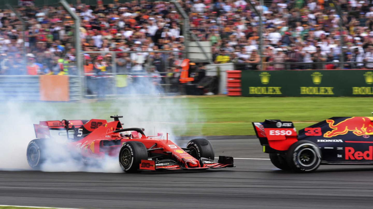 SILVERSTONE, UNITED KINGDOM - JULY 14: Sebastian Vettel, Ferrari SF90 running into the back of Max Verstappen, Red Bull Racing RB15 during the British GP at Silverstone on July 14, 2019 in Silverstone, United Kingdom. (Photo by Hasan Bratic / LAT Images)