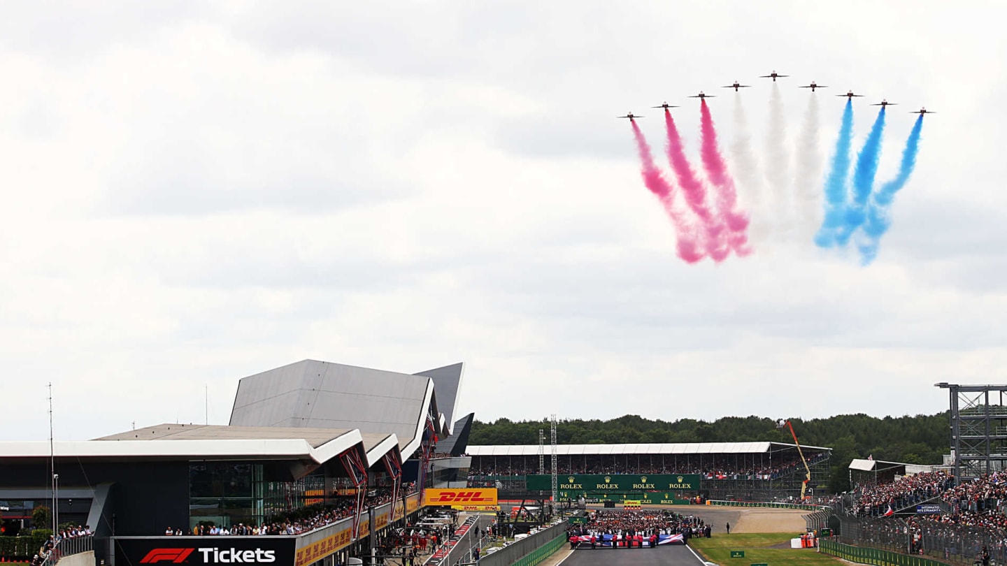 SILVERSTONE, UNITED KINGDOM - JULY 14: The Red Arrows fly over the grid during the British GP at Silverstone on July 14, 2019 in Silverstone, United Kingdom. (Photo by JEP / LAT Images)