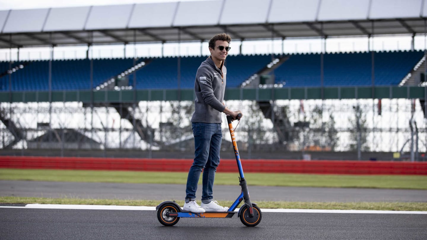 SILVERSTONE, UNITED KINGDOM - JULY 11: Lando Norris, McLaren walks the track on a scooter during
