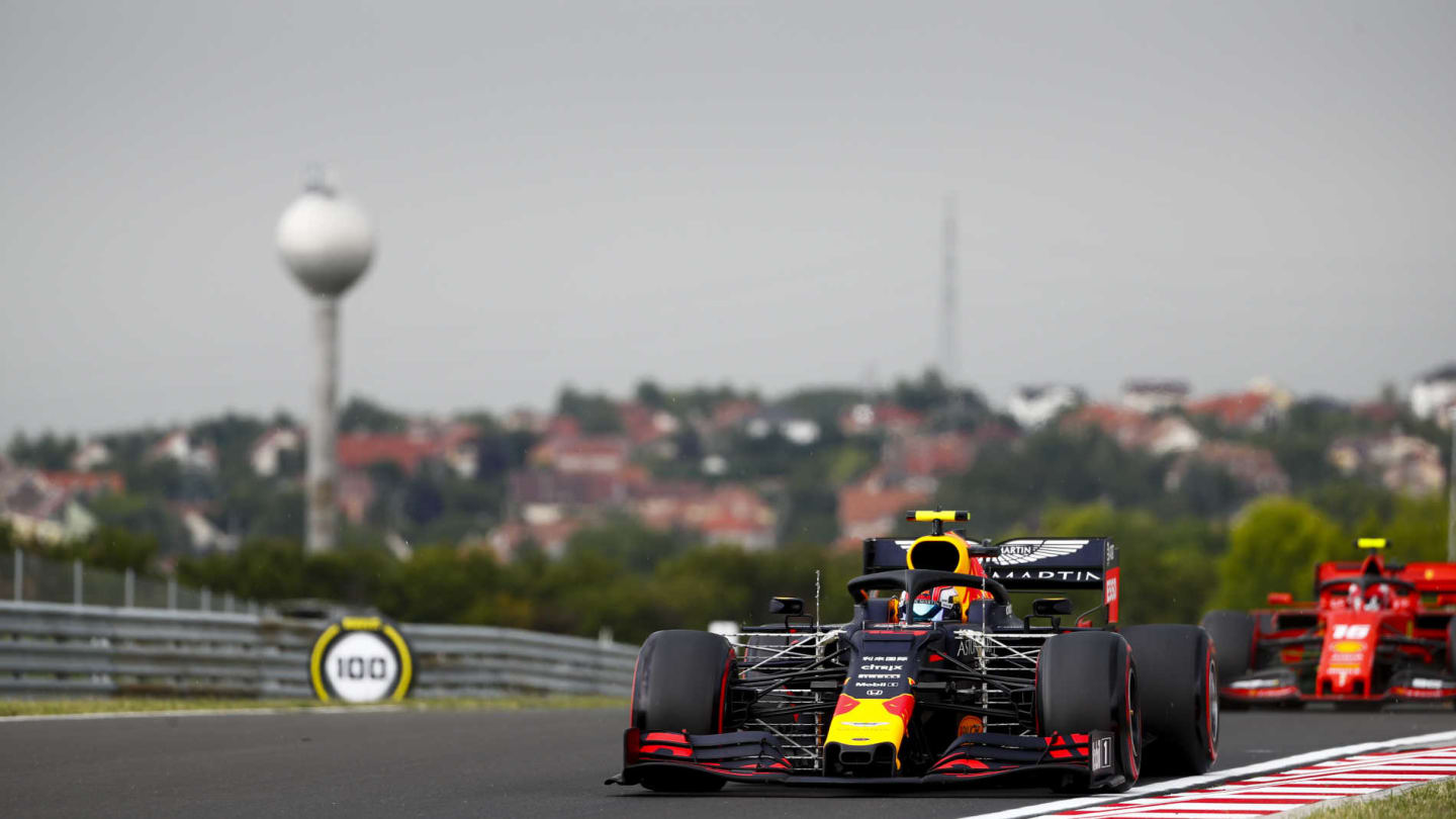 HUNGARORING, HUNGARY - AUGUST 02: Pierre Gasly, Red Bull Racing RB15, leads Charles Leclerc,