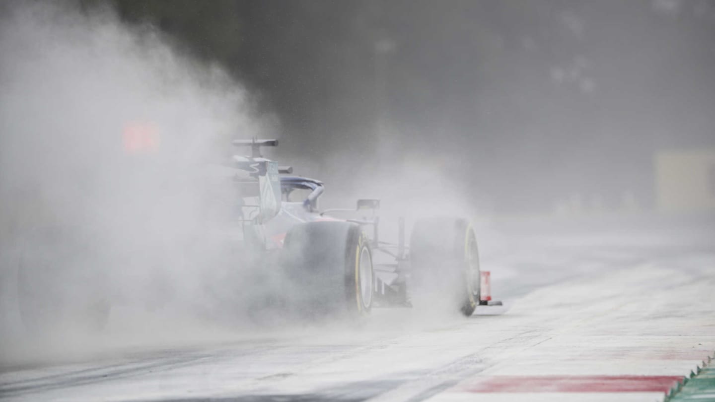 HUNGARORING, HUNGARY - AUGUST 03: Daniil Kvyat, Toro Rosso STR14, kicks up cement dust which was laid down to cover a heavy oil spill in the F2 race prior to the session during the Hungarian GP at Hungaroring on August 03, 2019 in Hungaroring, Hungary. (Photo by Sam Bloxham / LAT Images)