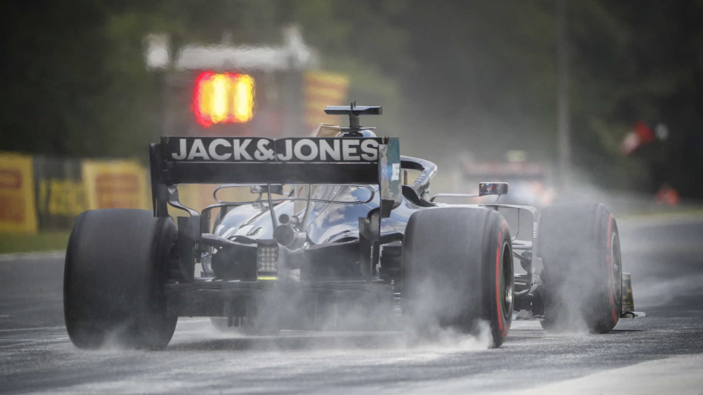 HUNGARORING, HUNGARY - AUGUST 03: Romain Grosjean, Haas VF-19, kicks up cement dust which was laid