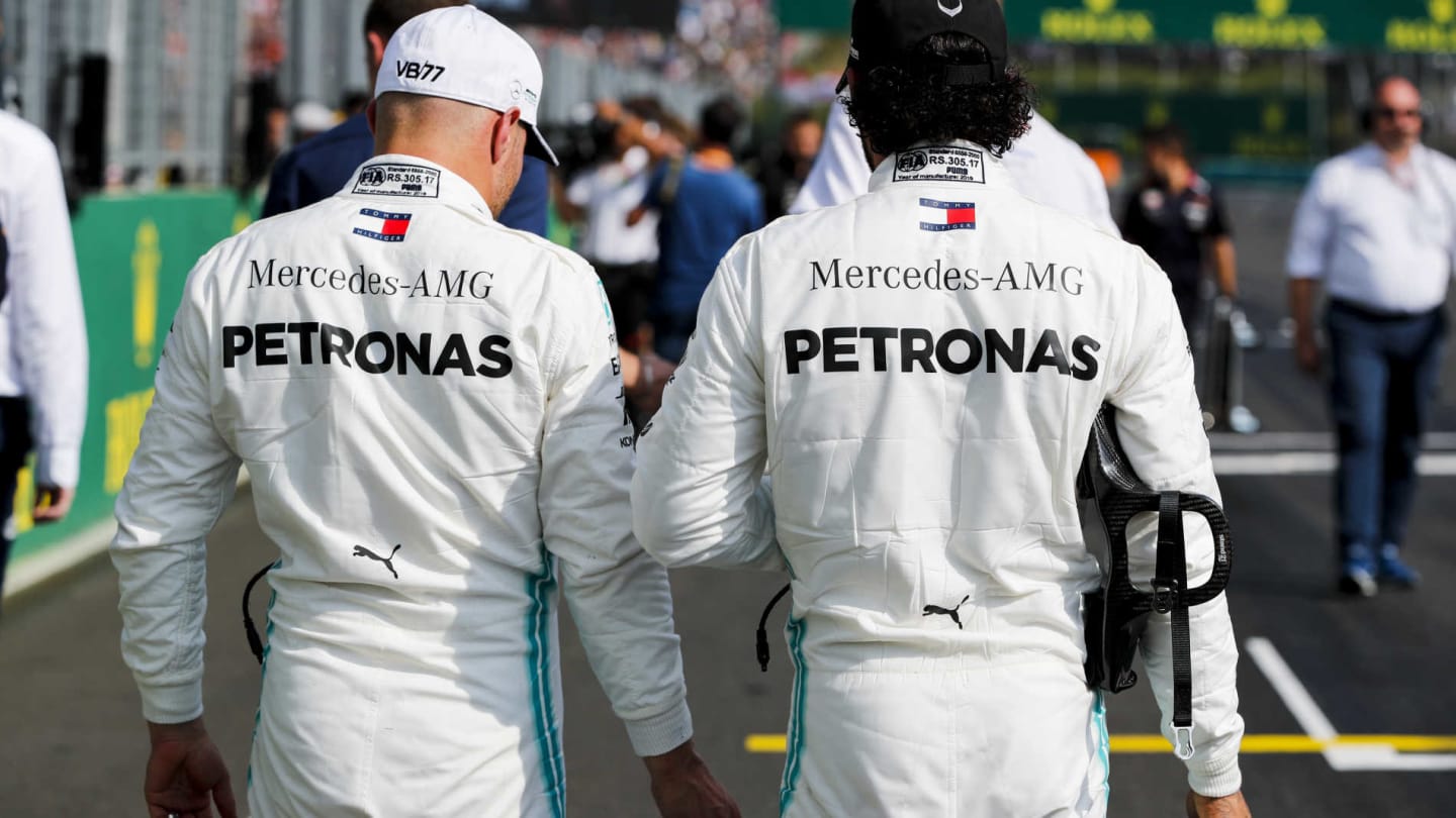 HUNGARORING, HUNGARY - AUGUST 03: Valtteri Bottas, Mercedes AMG F1, and Lewis Hamilton, Mercedes AMG F1, on the grid after Qualifying during the Hungarian GP at Hungaroring on August 03, 2019 in Hungaroring, Hungary. (Photo by Steven Tee / LAT Images)