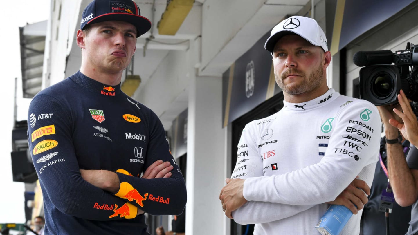 HUNGARORING, HUNGARY - AUGUST 03: Front row starters Max Verstappen, Red Bull Racing, and Valtteri Bottas, Mercedes AMG F1 during the Hungarian GP at Hungaroring on August 03, 2019 in Hungaroring, Hungary. (Photo by Mark Sutton / Sutton Images)