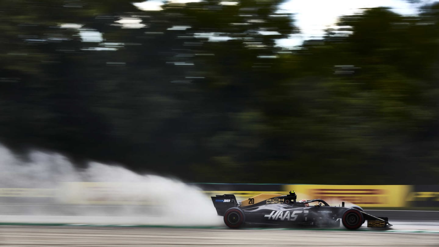 HUNGARORING, HUNGARY - AUGUST 03: Kevin Magnussen, Haas VF-19, kicks up cement dust used to cover oil from a previous on track session during the Hungarian GP at Hungaroring on August 03, 2019 in Hungaroring, Hungary. (Photo by Steve Etherington / LAT Images)