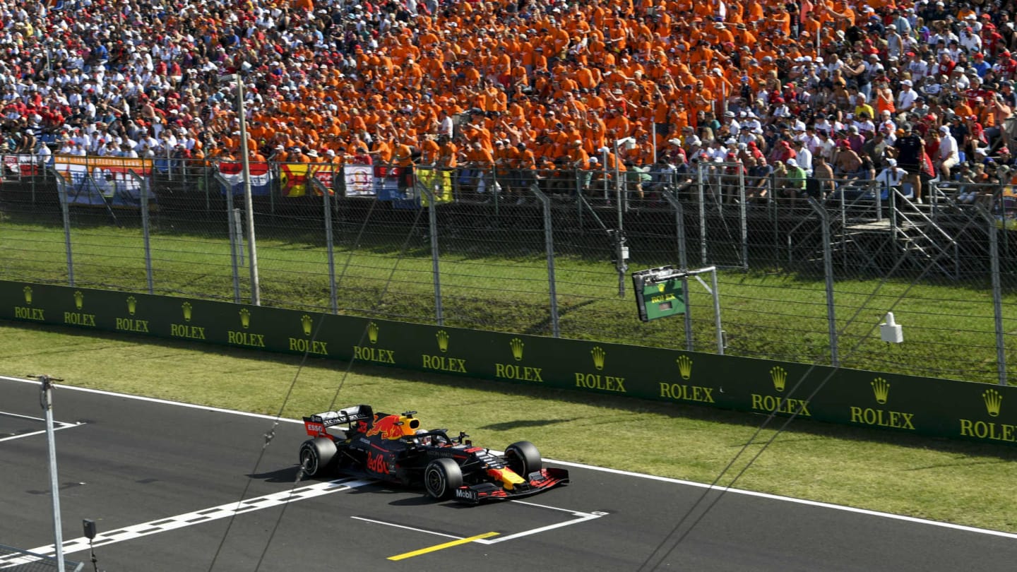 HUNGARORING, HUNGARY - AUGUST 04: Max Verstappen, Red Bull Racing RB15 passes fans during the