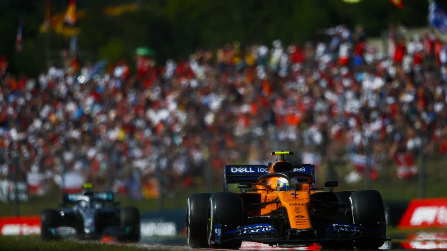 HUNGARORING, HUNGARY - AUGUST 04: Lando Norris, McLaren MCL34, leads Valtteri Bottas, Mercedes AMG W10 during the Hungarian GP at Hungaroring on August 04, 2019 in Hungaroring, Hungary. (Photo by Andy Hone / LAT Images)