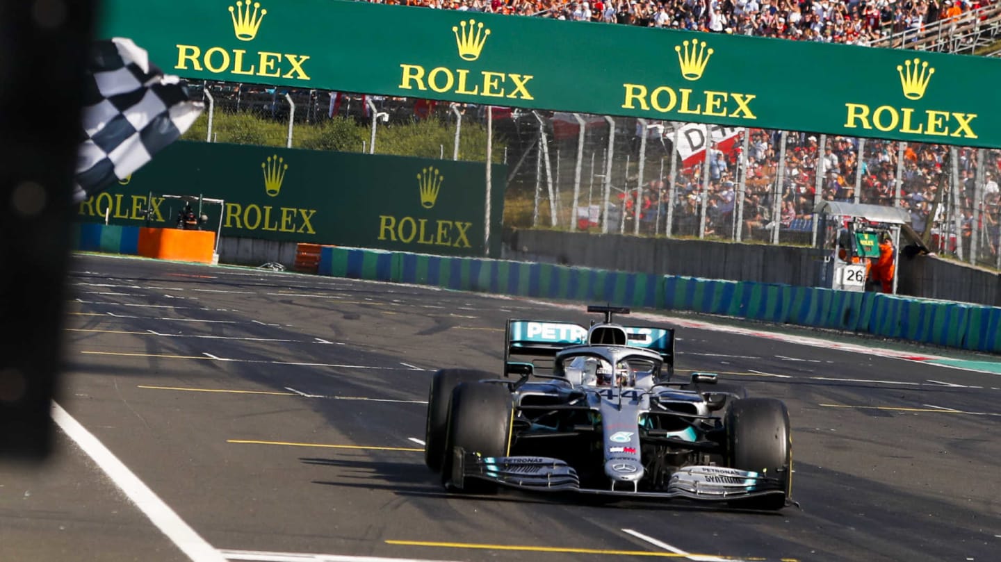 HUNGARORING, HUNGARY - AUGUST 04: Race winner Lewis Hamilton, Mercedes AMG F1 W10 crosses the