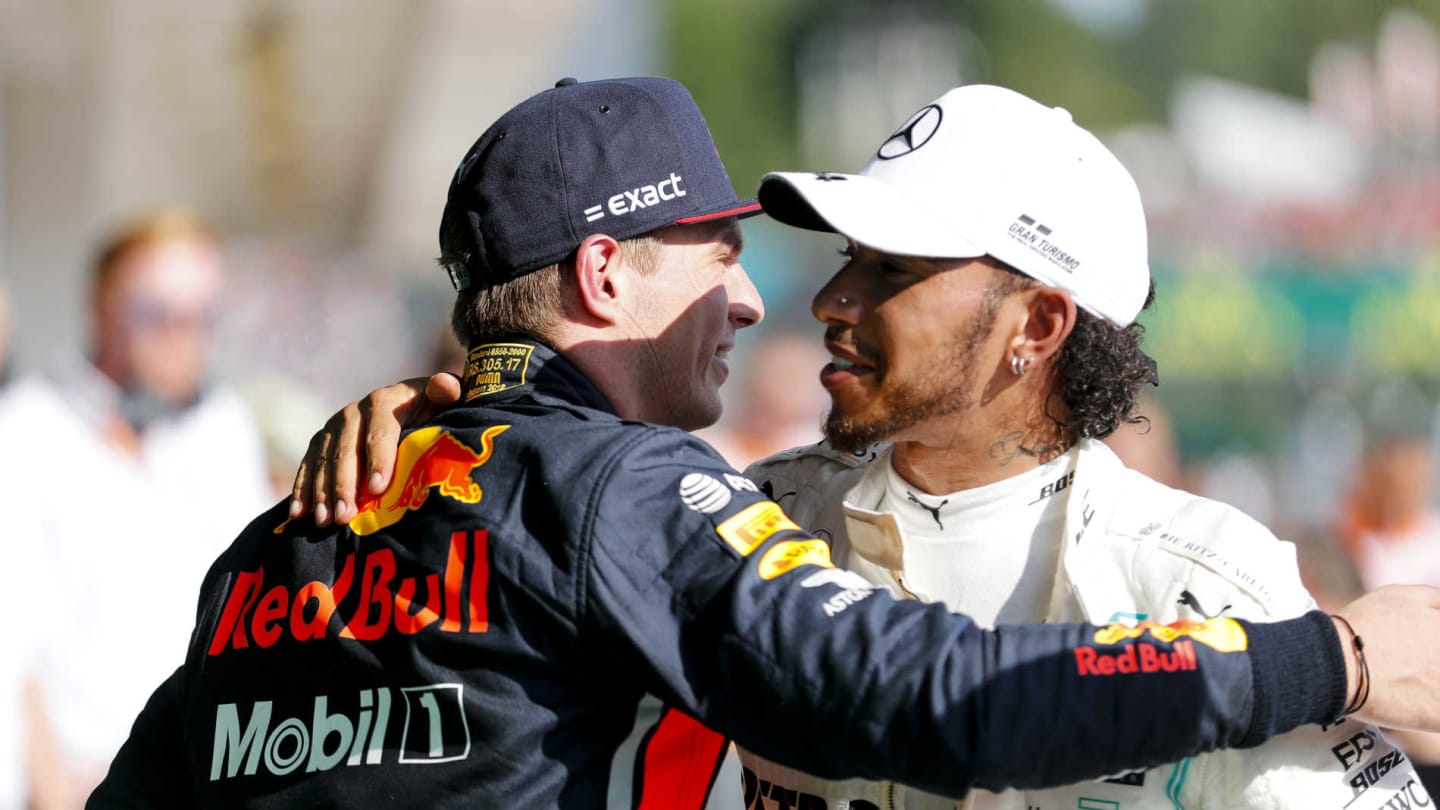 HUNGARORING, HUNGARY - AUGUST 04: Max Verstappen, Red Bull Racing and Race winner Lewis Hamilton, Mercedes AMG F1 celebrate in Parc Ferme during the Hungarian GP at Hungaroring on August 04, 2019 in Hungaroring, Hungary. (Photo by Steven Tee / LAT Images)