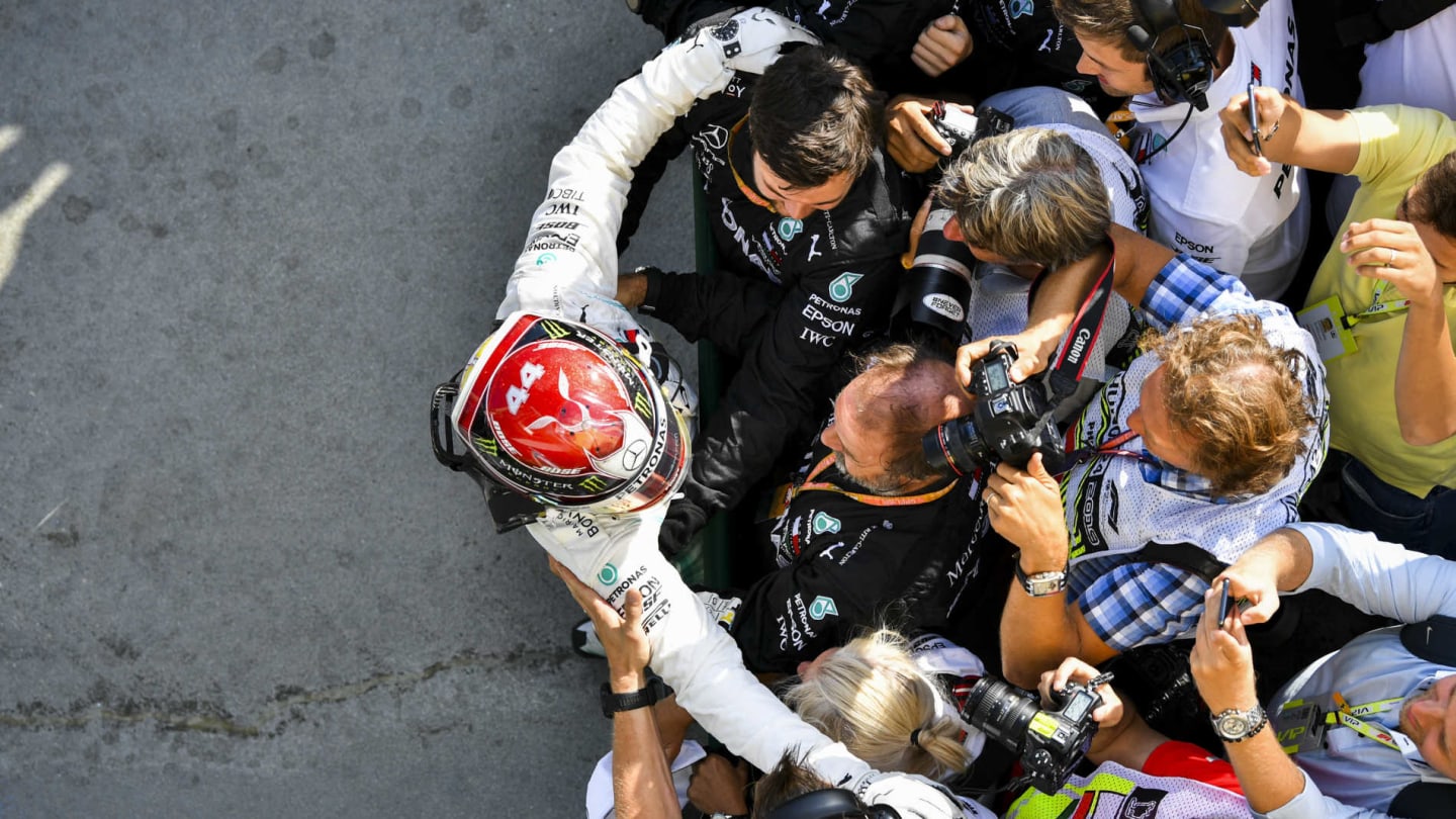 HUNGARORING, HUNGARY - AUGUST 04: Lewis Hamilton, Mercedes AMG F1, 1st position, celebrates with his team in Parc Ferme during the Hungarian GP at Hungaroring on August 04, 2019 in Hungaroring, Hungary. (Photo by Mark Sutton / Sutton Images)