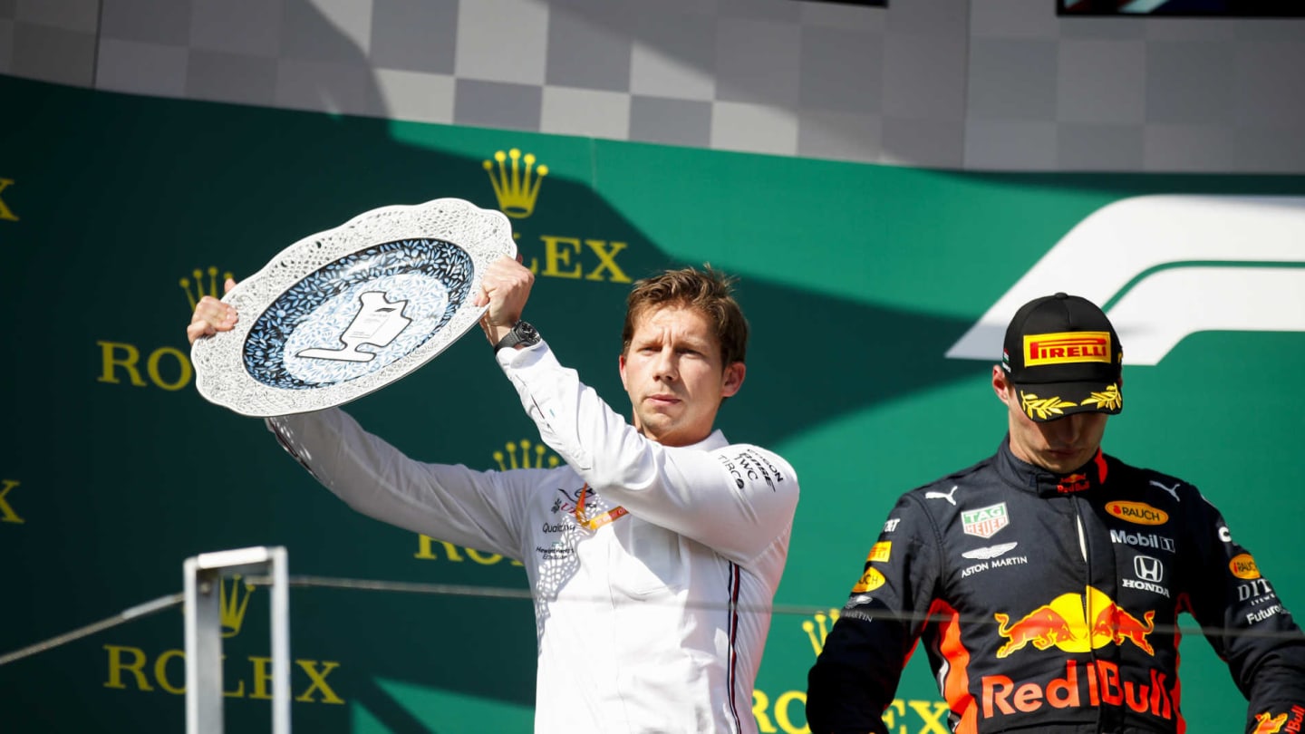 HUNGARORING, HUNGARY - AUGUST 04: Matt Deane, Chief Mechanic, Mercedes AMG, receives the Constructors trophy for Mercedes alongside Max Verstappen, Red Bull Racing, 2nd position during the Hungarian GP at Hungaroring on August 04, 2019 in Hungaroring, Hungary. (Photo by Joe Portlock / LAT Images)